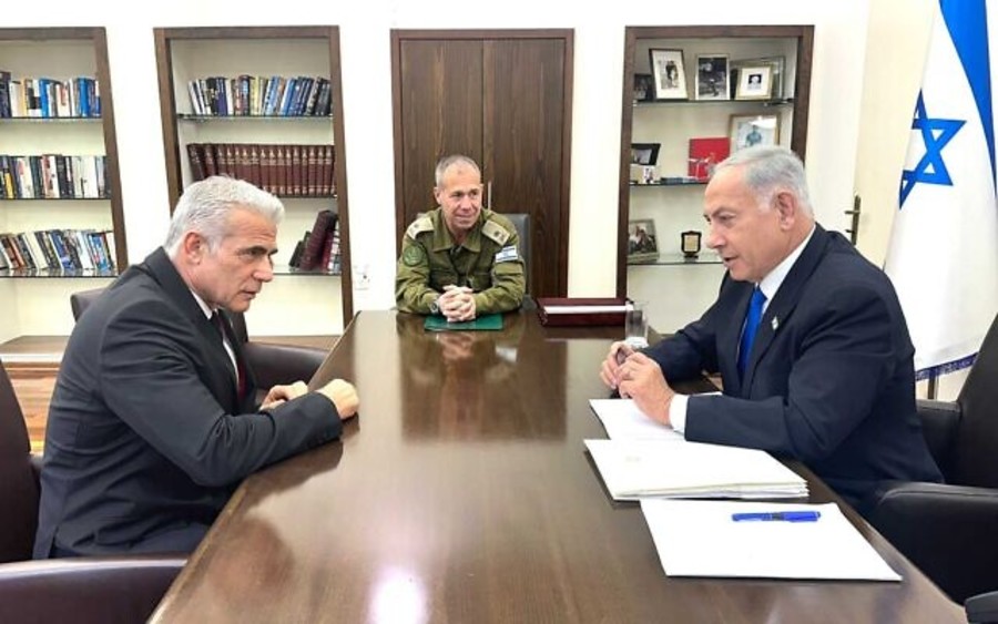 Opposition leader Yair Lapid and Prime Minister Benjamin Netanyahu at a security meeting at military HQ in Tel Aviv, April 9, 2023. (Photo: Government handout)
