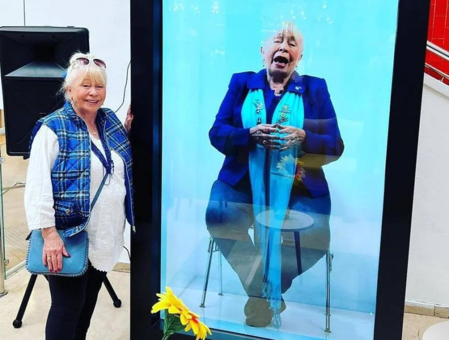 Deborah Weinstein next to her hologram (Photo courtesy eyefeelit)