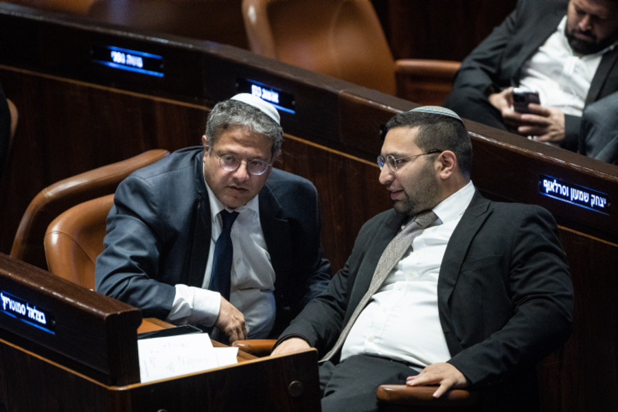 Head of the Otzma Yehudit party MK Itamar Ben Gvir with MK Yitzhak Wasserlauf at a plenum session at the assembly hall of the Knesset, the Israeli parliament in Jerusalem, on Dec. 14, 2022. Photo by Yonatan Sindel/Flash90