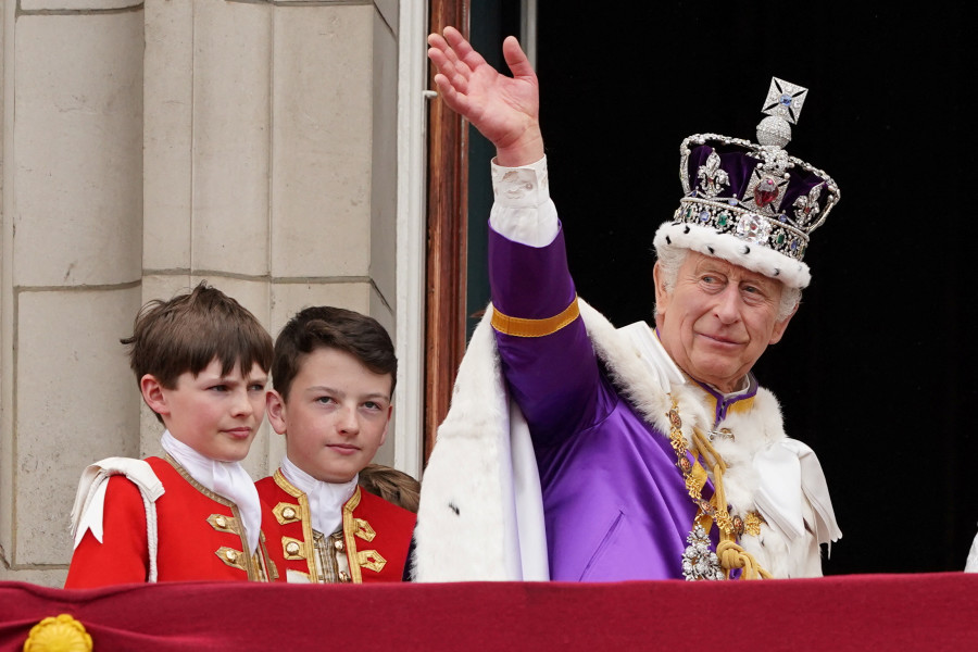 King Charles III waves as he leaves the balcony of Buckingham Palace, London, following the coronation, May 6, 2023. (Photo: Stefan Rousseau/Pool via Reuters)