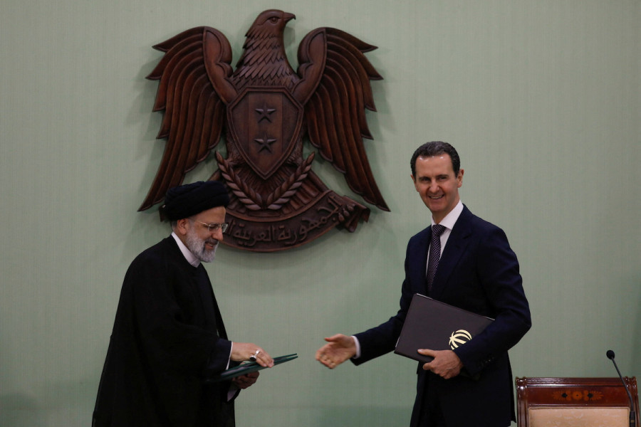 Syria's President Bashar al-Assad and Iranian President Ebrahim Raisi during the signing of cooperation agreement in Damascus, Syria, May 3, 2023. (Photo: REUTERS/Yamam al Shaar)