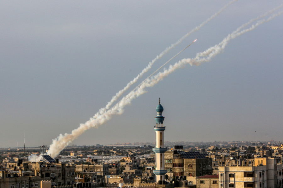 Trails of smoke are seen as rockets are fired from Gaza towards Israel, in the southern Gaza Strip, on May 11, 2023. Photo by Abed Rahim Khatib/Flash90