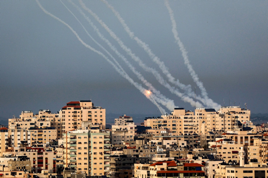 Trails of smoke are seen as rockets are fired from Gaza towards Israel, in the southern Gaza Strip, on May 11, 2023. Photo by Atia Mohammed/Flash90