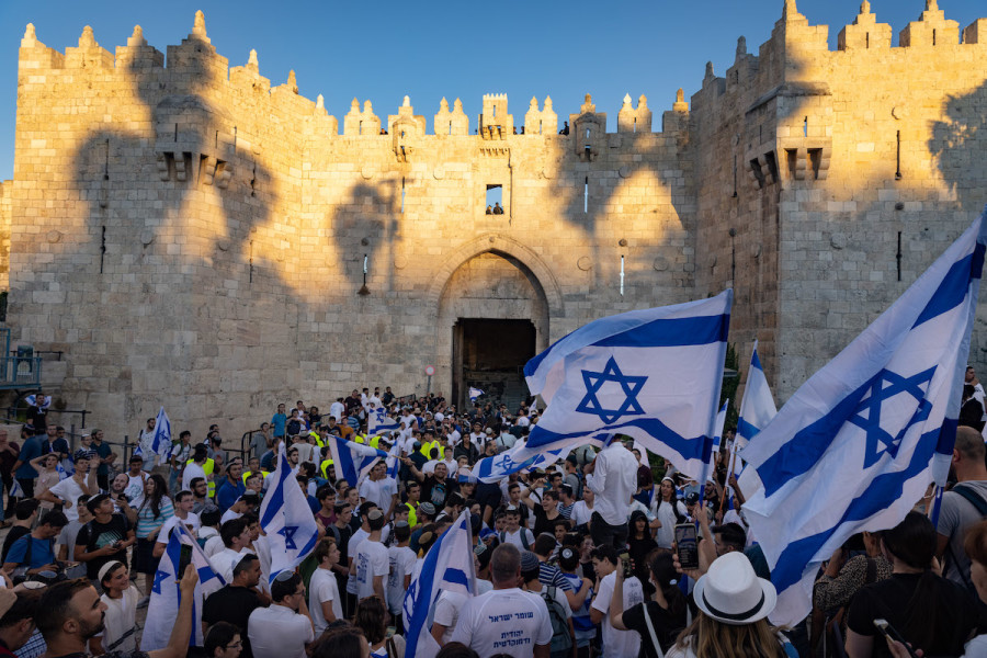 Israelis hold Israeli flags and dance during the Flag March at Damascus Gate in Jerusalem's Old City, June 15, 2021. (Photo: Photo by Olivier Fitoussi/Flash90)