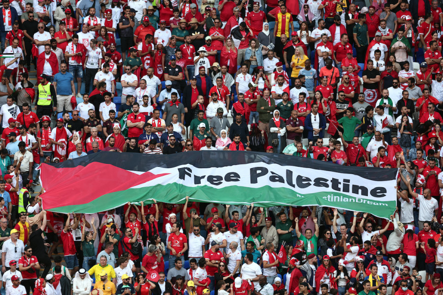 Fans unveil a banner with the message 'Free Palestine' at a match between Tunisia and Australia during the World Cup in Qatar, Nov. 26, 2022 (Photo: REUTERS/Marko Djurica)