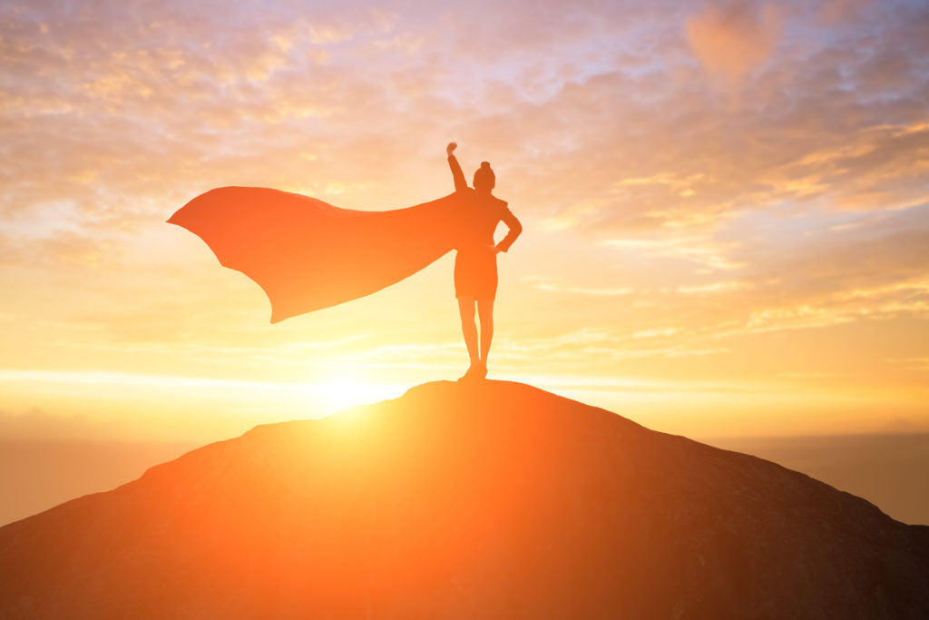 Standing on a hill looking at the sunset | HealthMasters