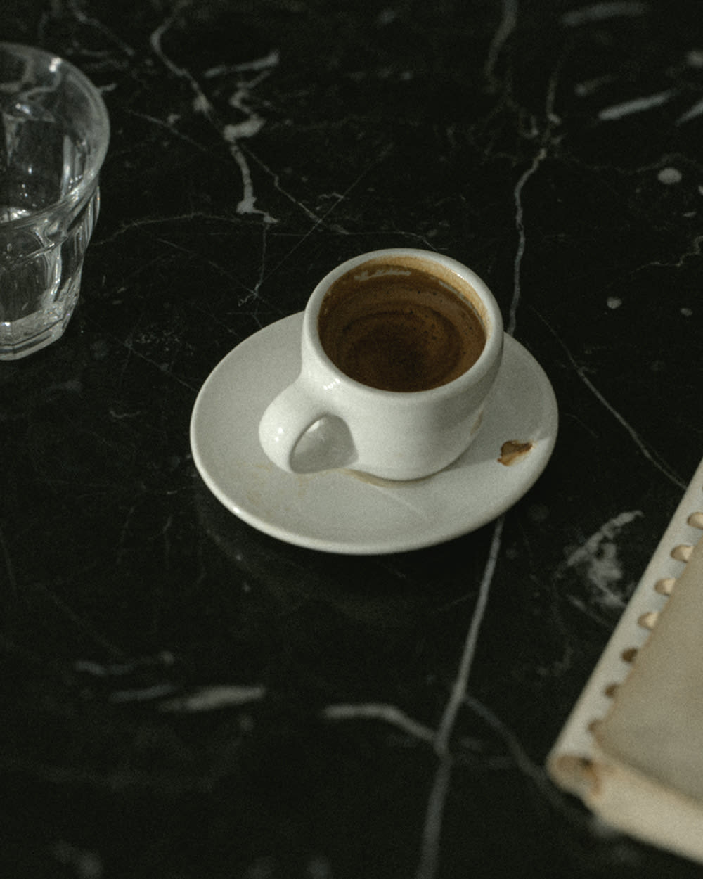 Espresso on a stack of saucers.