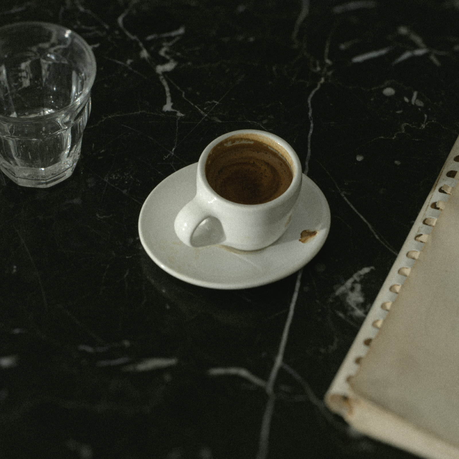 Espresso on a stack of saucers.