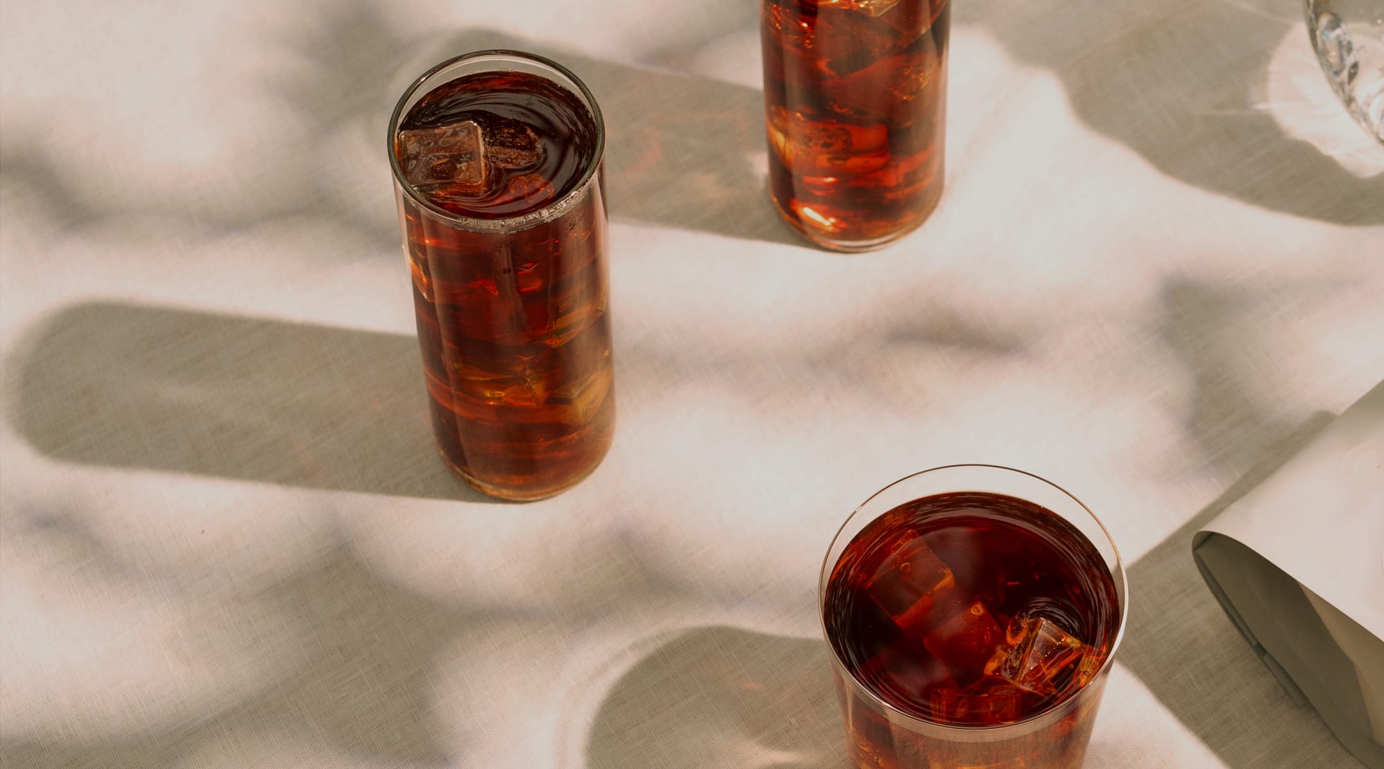 Photo of cold brew coffee in glasses on table