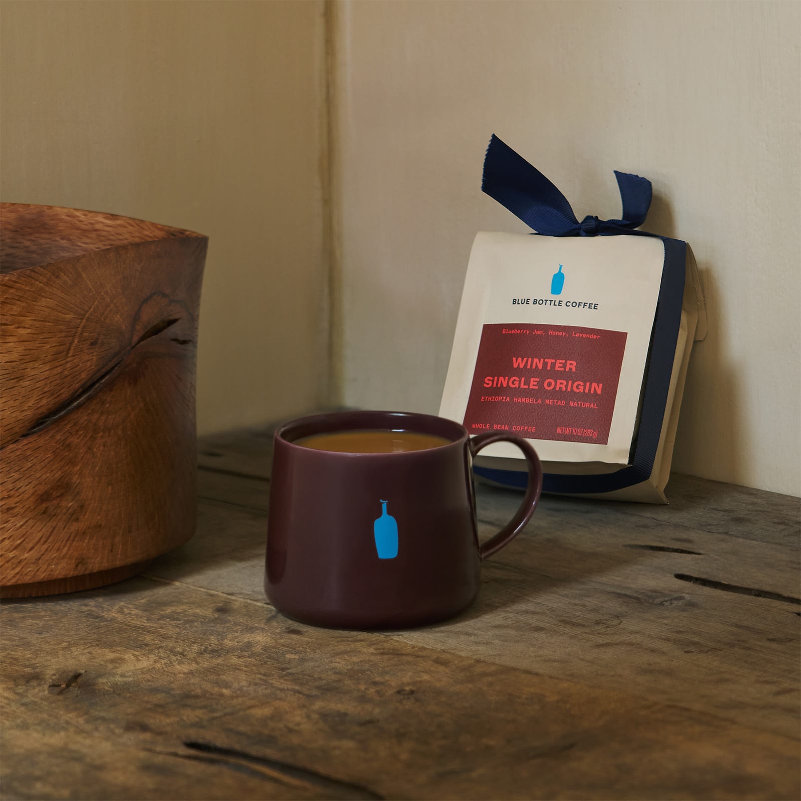 red holiday mug and single origin whole bean coffee