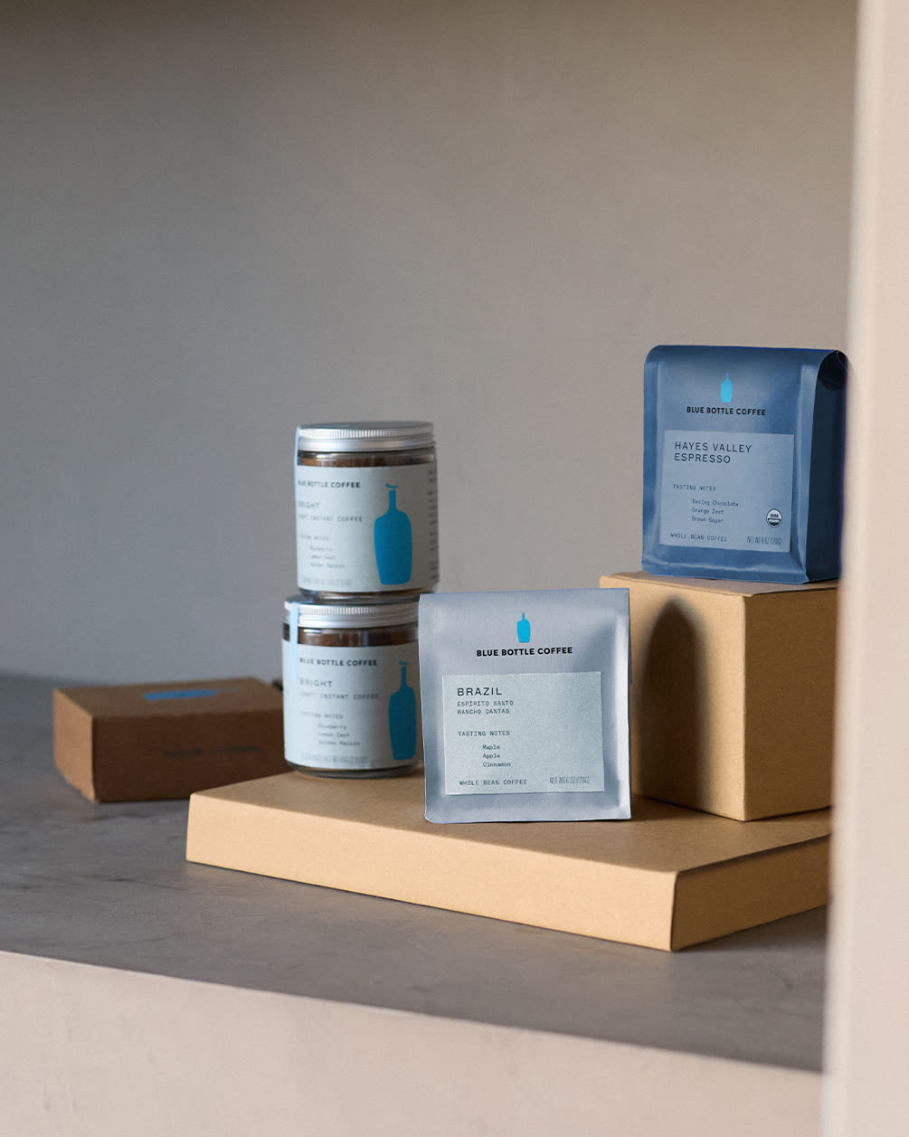 two whole bean coffee bags and blue bottle instant coffee