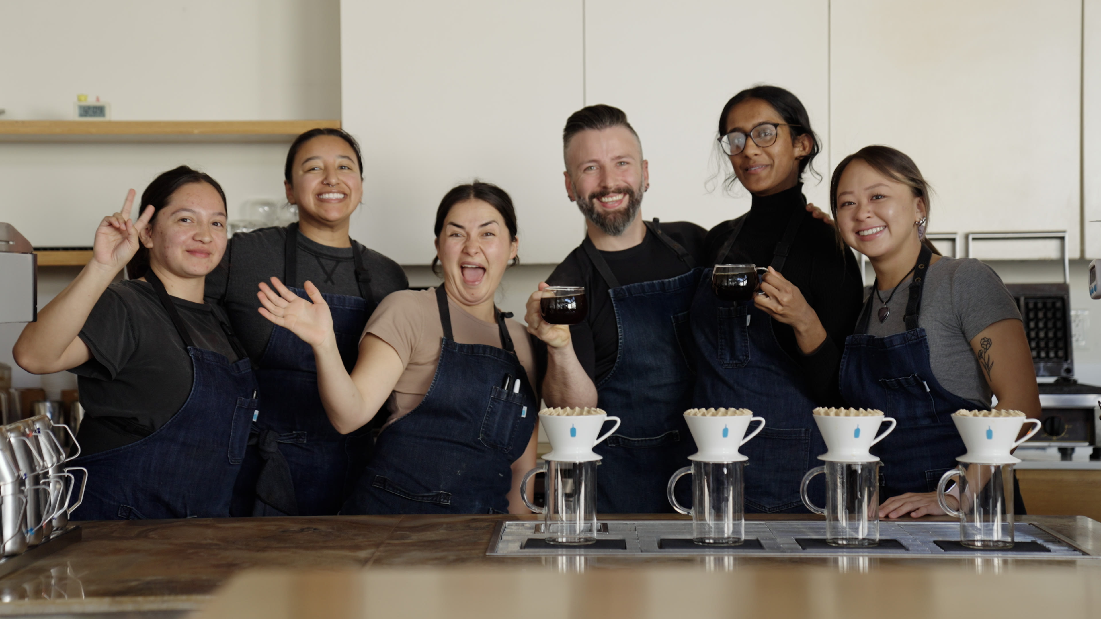 blue bottle coffee baristas smile