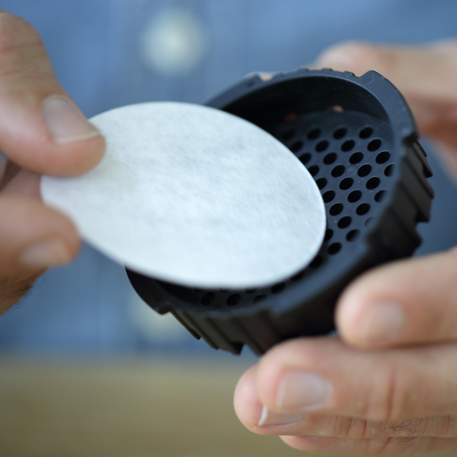 Filter being placed in the cap of the aeropress.