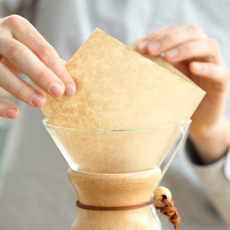 A filter being placed into a Chemex