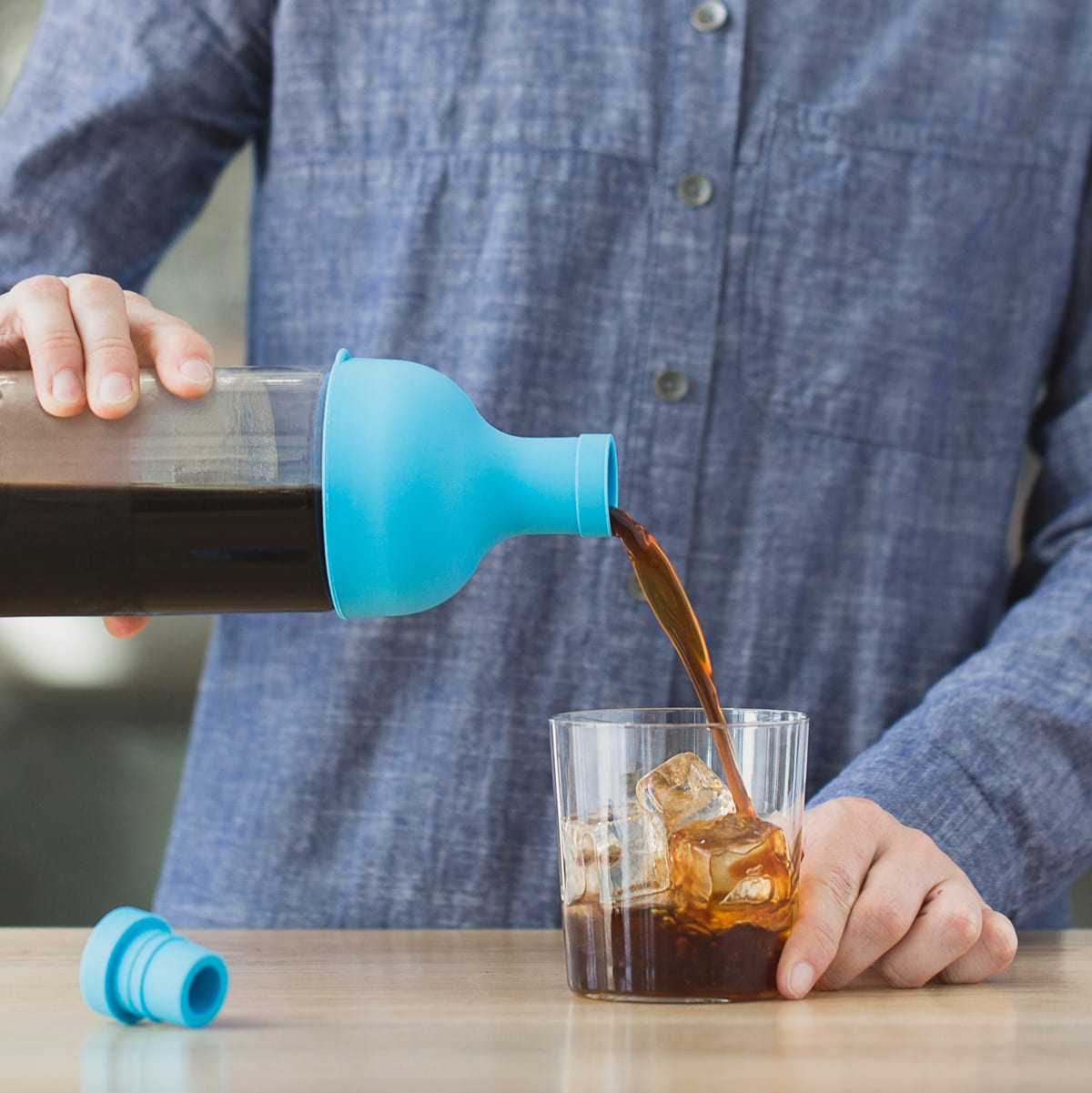 Cold brew being poured into a glass.