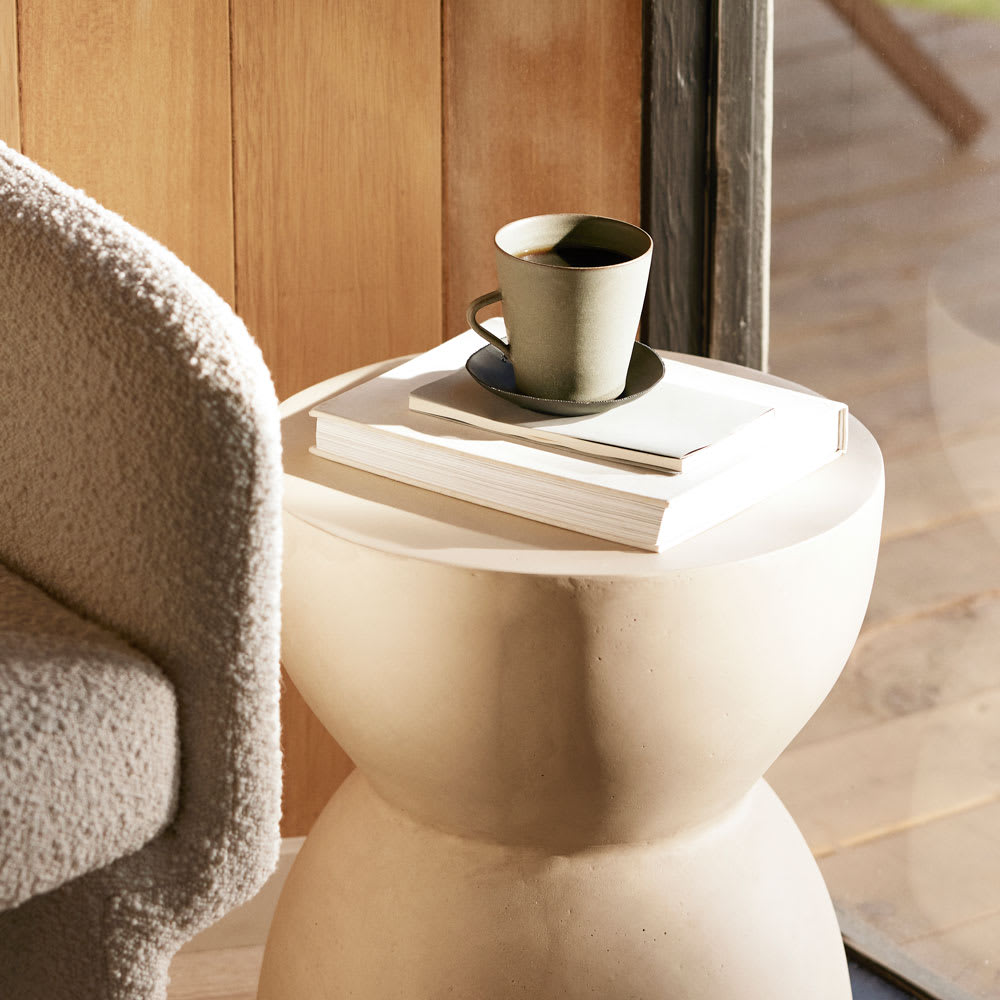 Cup of coffee on a stack of books.