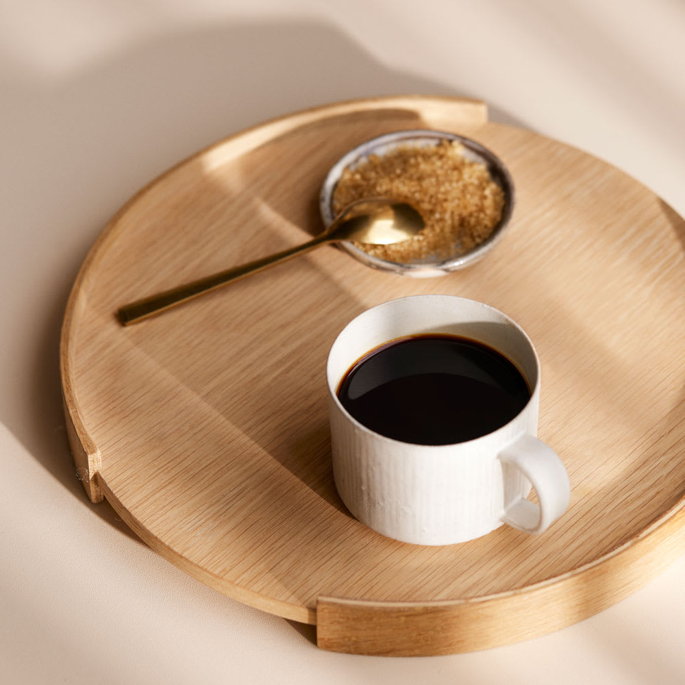 balanced blend coffee on wooden tray