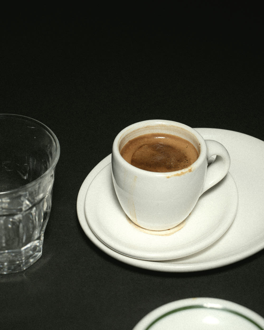 A latte in a ceramic mug on a table.