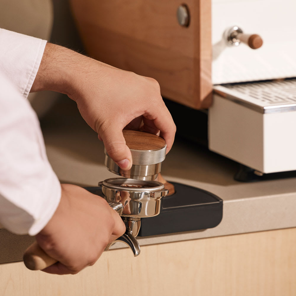 BT Wedge Distribution Tool tamping into espresso portafilter