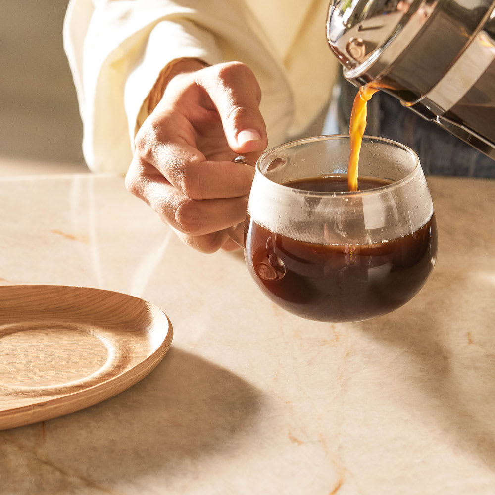 coffee being poured into kinto cup