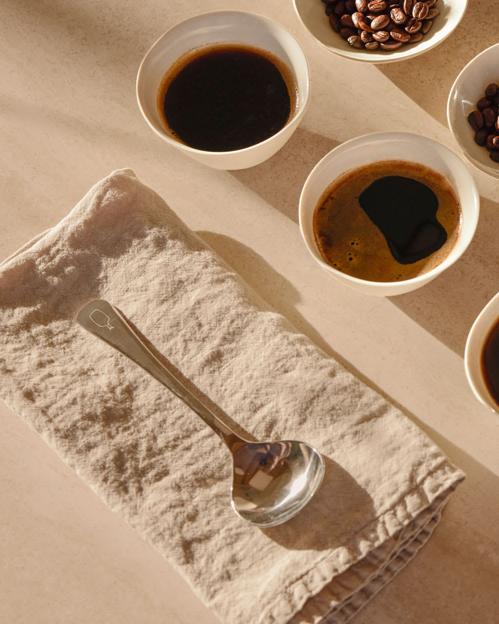 Blue Bottle Cupping Spoon on a linen napkin.