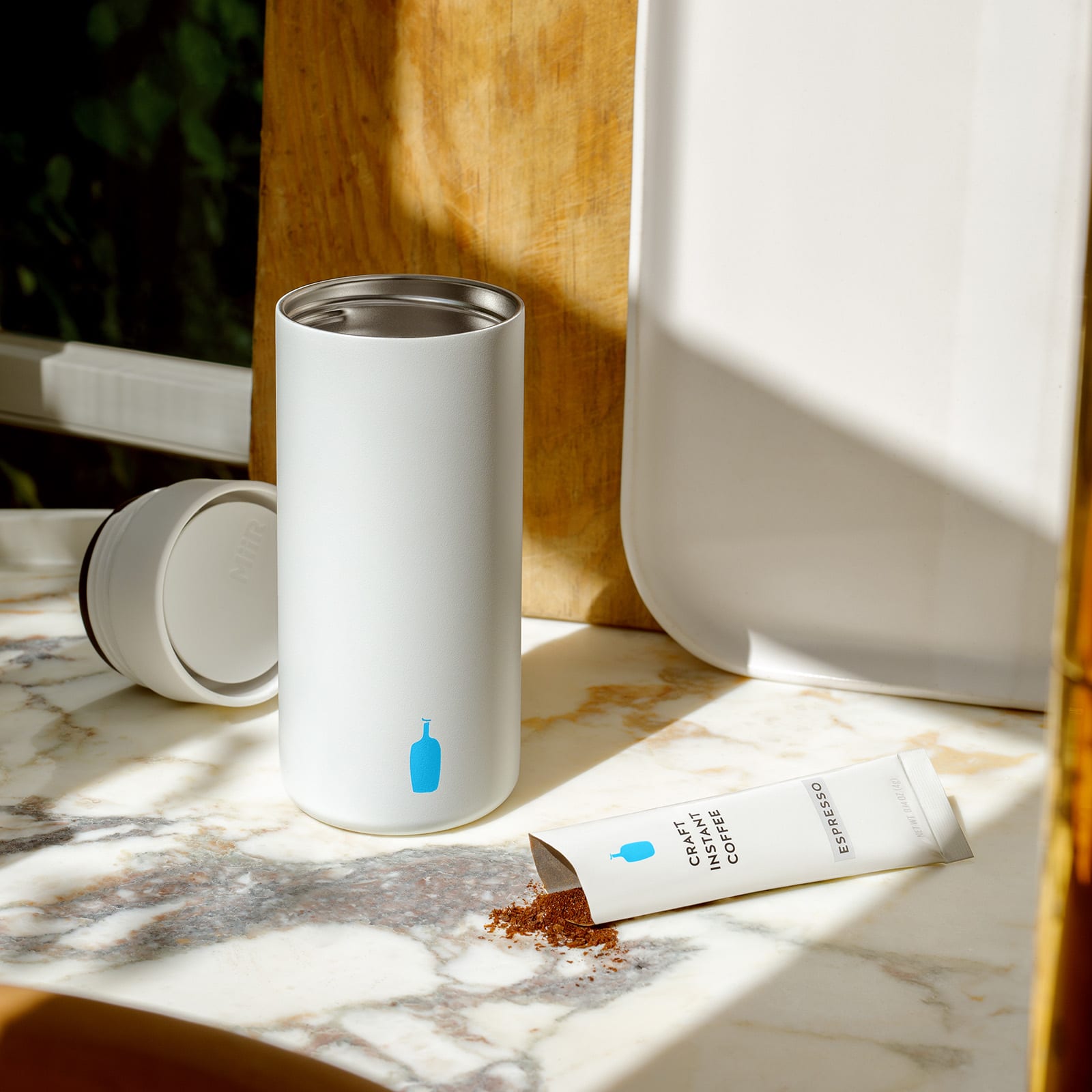 MiiR 360 Traveler Tumbler in white with blue bottle logo