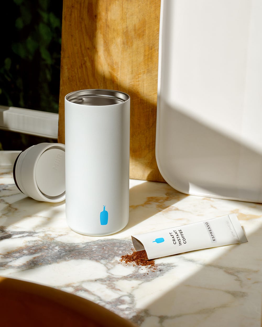 MiiR 360 Traveler Tumbler in white with blue bottle logo