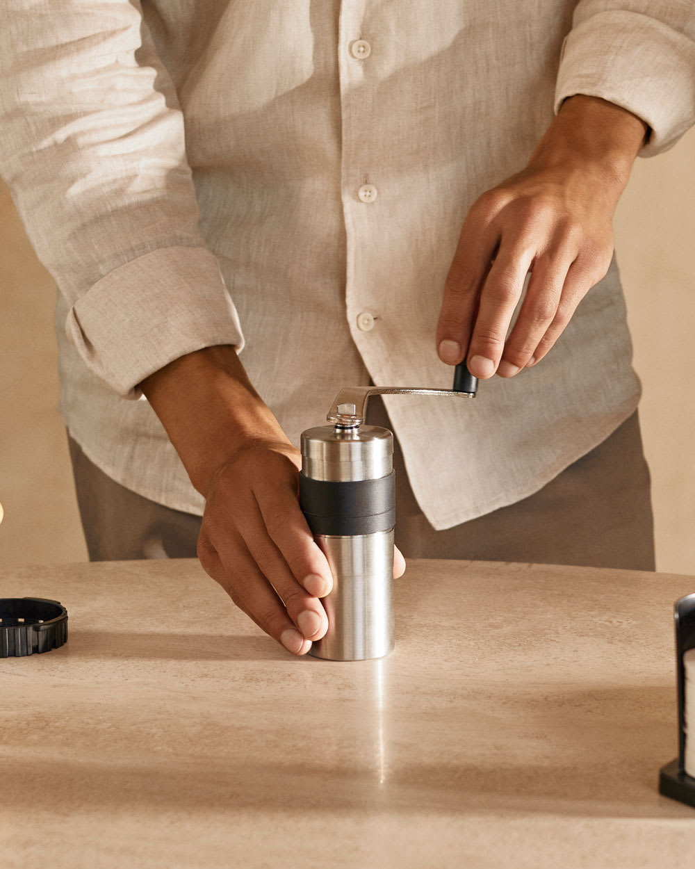 Person using the porlex mini grinder.