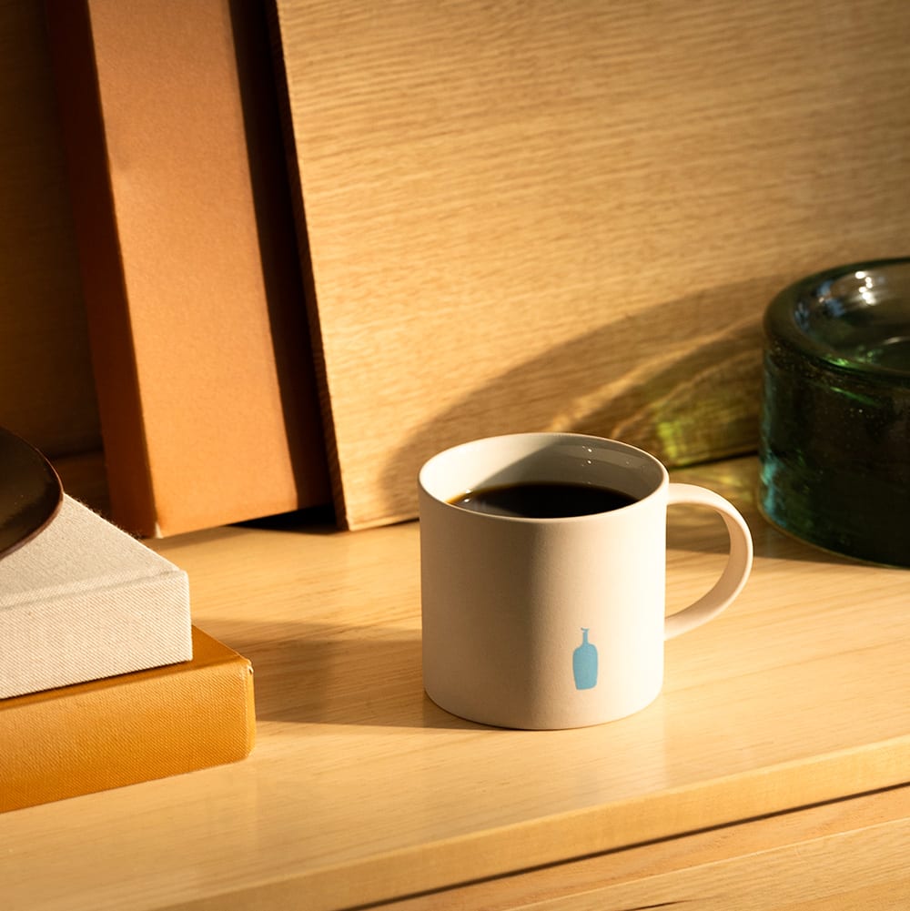 Blue Bottle Coffee Moheim Stoneware Mug in Grey with logo filled with Bella Donovan blend coffee