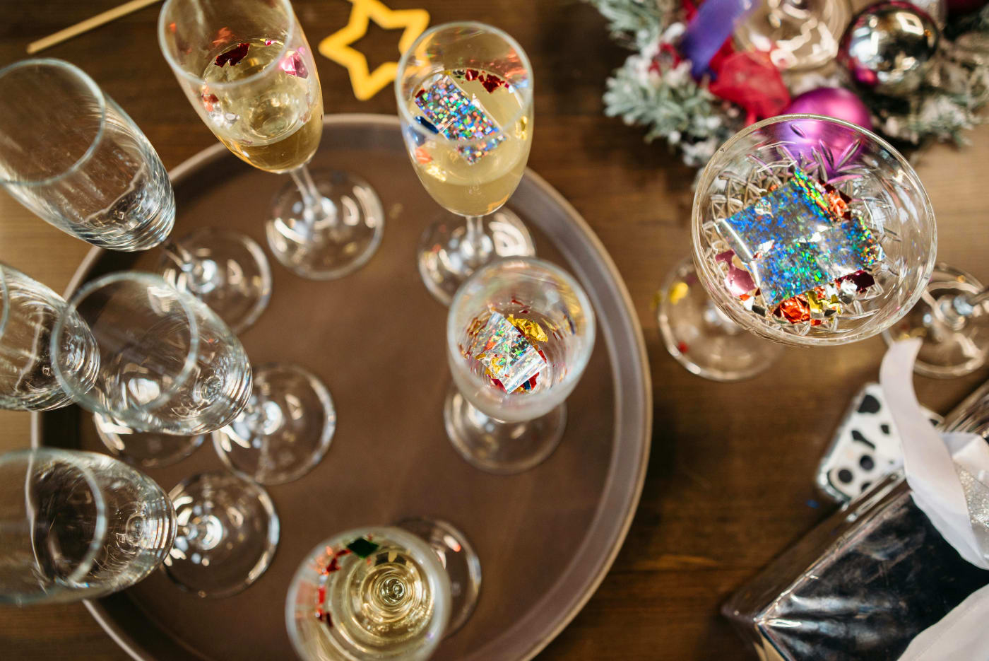 Elegant champagne glasses with edible glitter and festive decoration, perfect for New Years Eve.