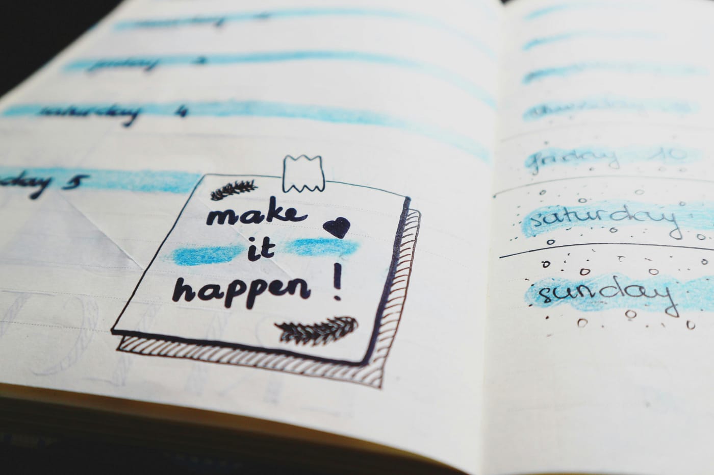 Open planner with the inspiring quote make it happen, perfect for planning the smooth execution of the Christmas dinner.
