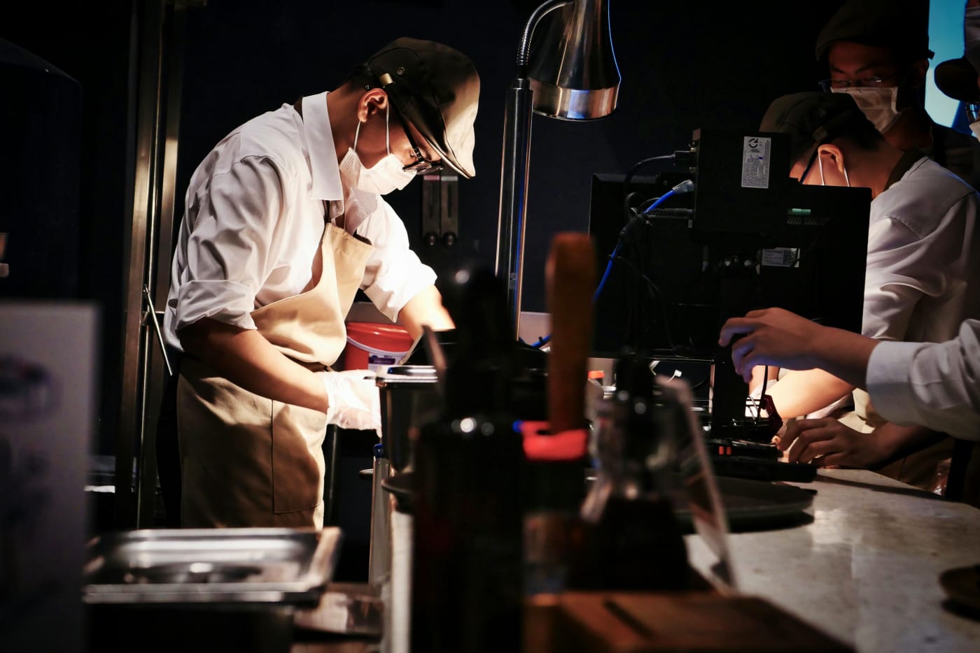 Chef in action, professionally preparing food for a wedding party, personal and exclusive menu.