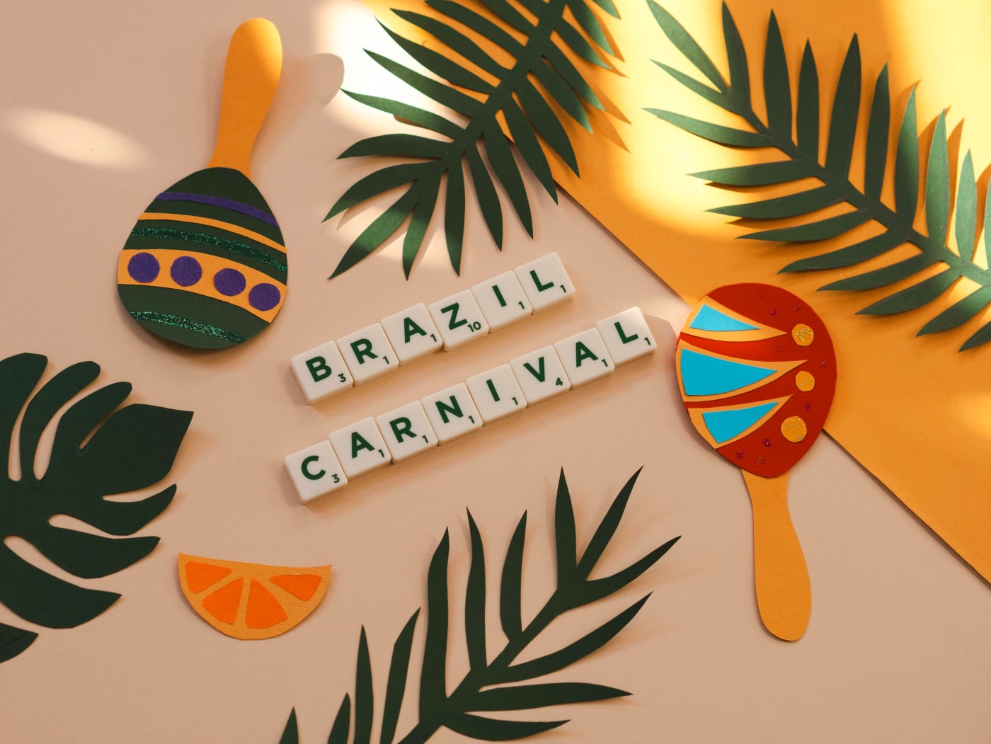 Colorful carnival decorations with palm leaves and maracas for party planning.