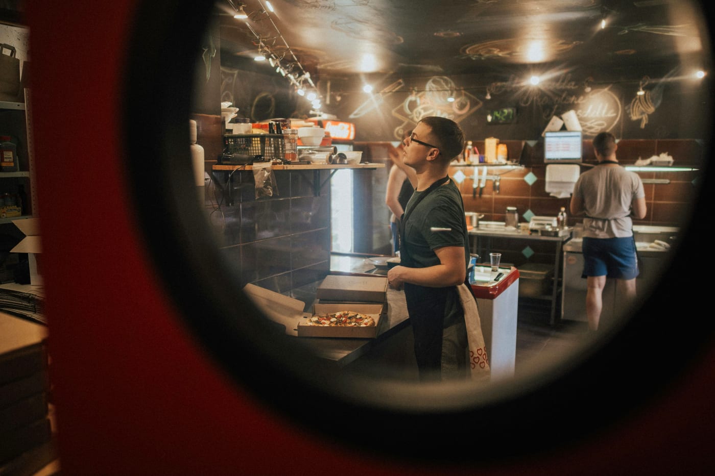 Chef in a kitchen preparing a wedding menu with a focus on communication and collaboration in the catering process.