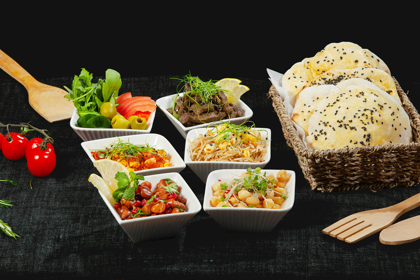 A selection of vegetarian side dishes, including fresh salads, delicious bread, and spicy accompaniments that perfectly complement the main courses.