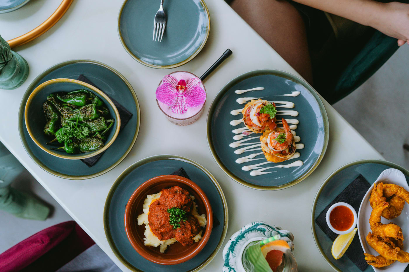 Modern appetizers with creative arrangements and different flavor profiles on elegant plates