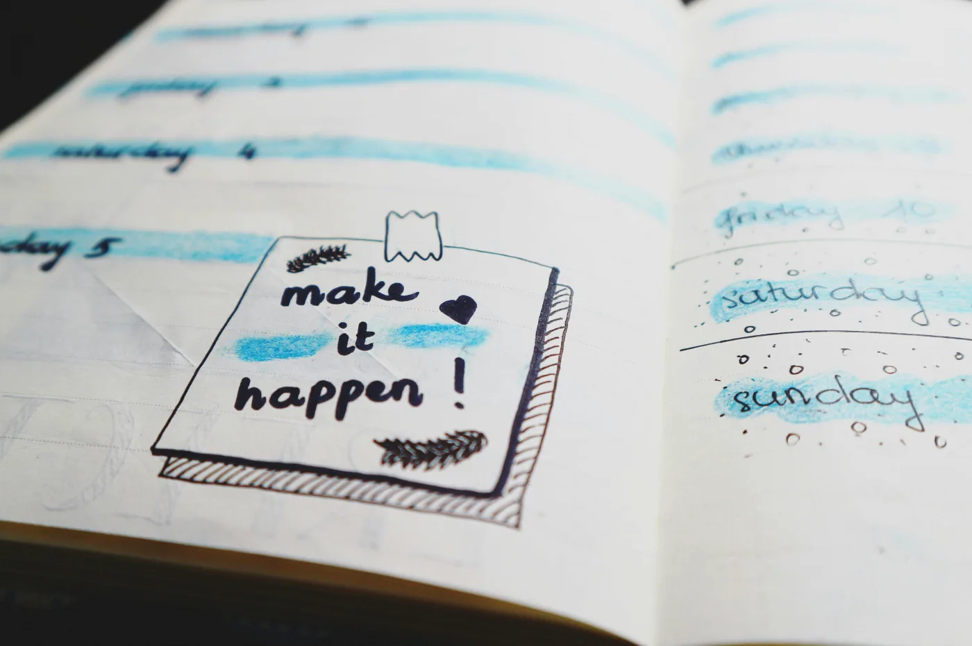 Open planner with inspiring quote make it happen, perfect for planning a smooth execution of the Christmas lunch.