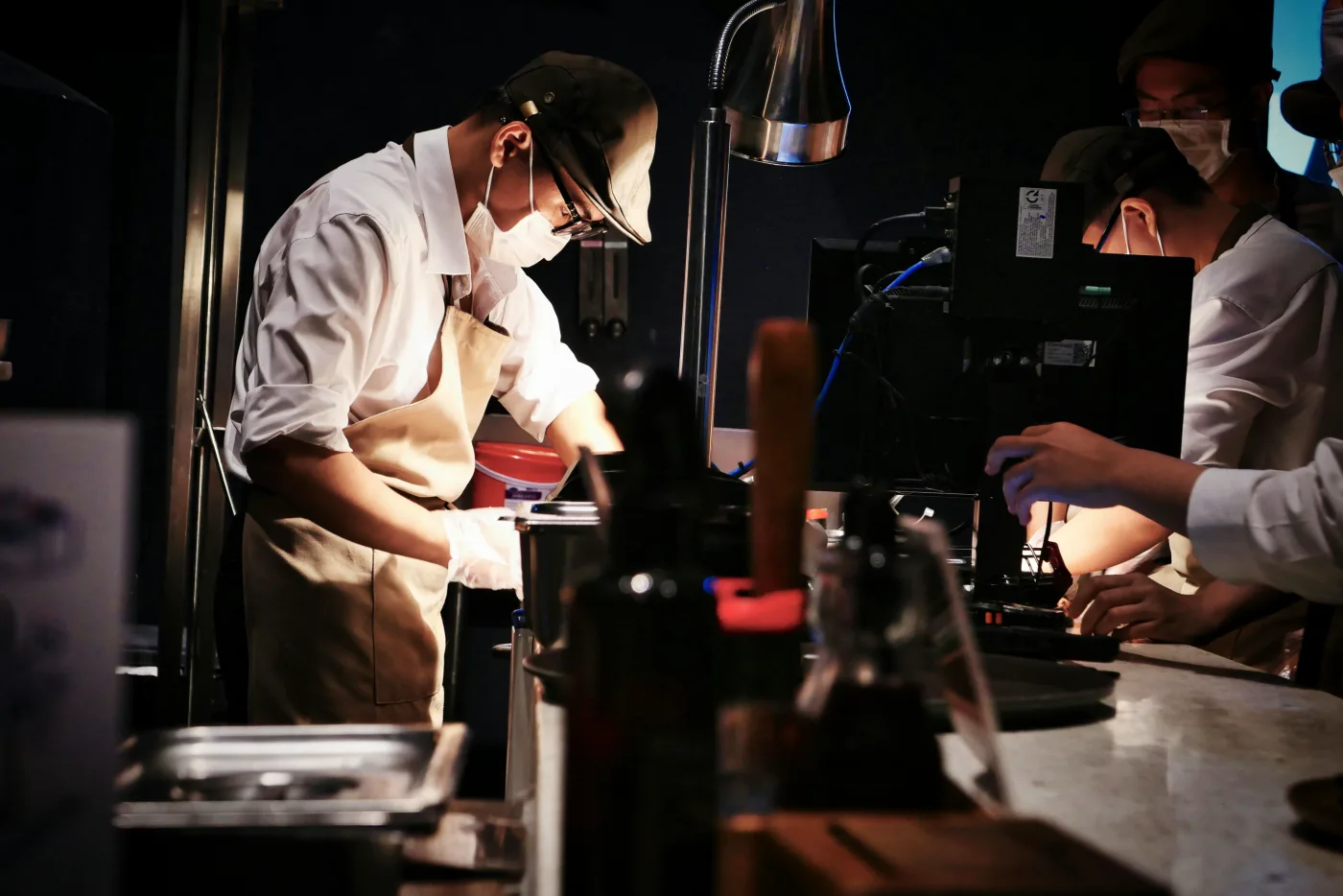 Professional chef preparing food in a kitchen, symbolizes stress-free confirmation with a customized menu.