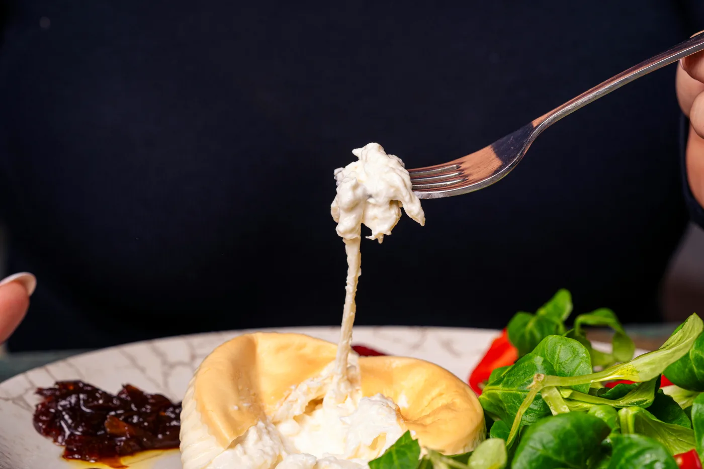 Gourmet dish elegantly plated with colorful ingredients and delicate details on a plate.