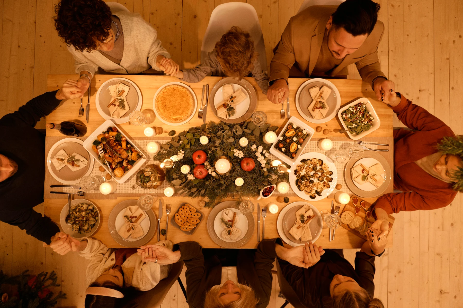 An enjoyable gathering with friends and family around a beautifully decorated table for Pentecost lunch or dinner, where guests enjoy a lovely meal.