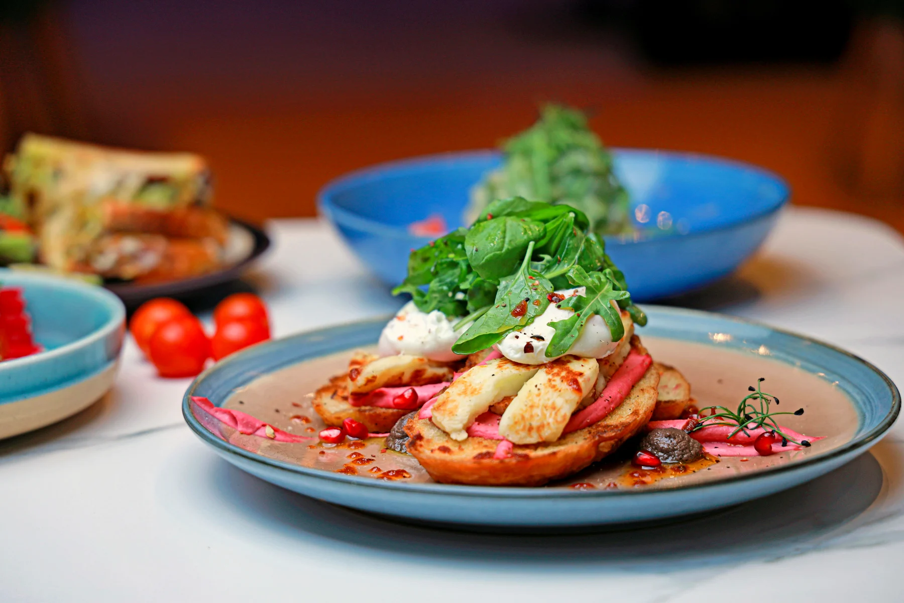 Gourmet dish with creative presentation and fresh ingredients on a plate, symbolizes culinary inspiration and diversity of taste experiences.