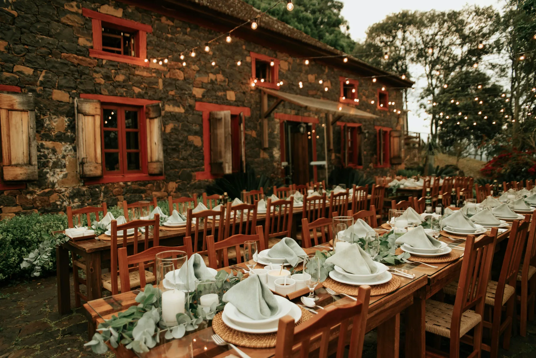 Festive crayfish party table decorated with simple elegance in a Nordic outdoor setting, ready for late summer tradition and social gathering.