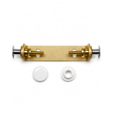 Caroma D87 Opal shroud bracket kit with brass mounting bracket, fixing hardware, and white cover caps, isolated on a white background