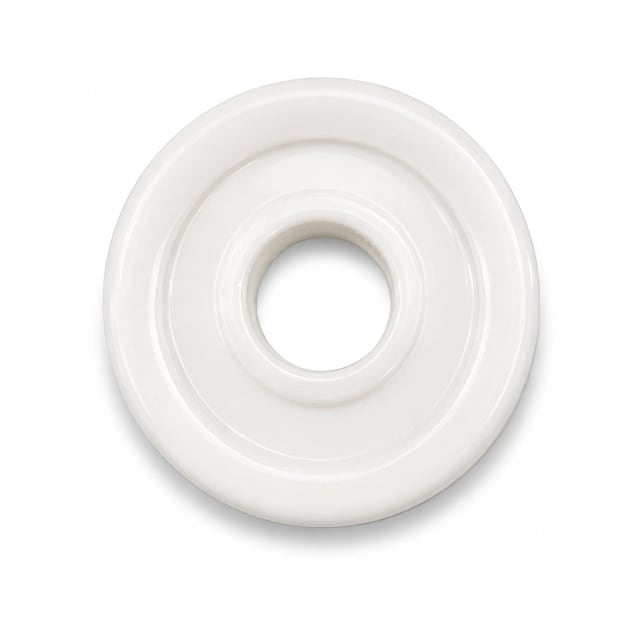 White plastic toilet seat spacer washer with a central hole on a white background.
