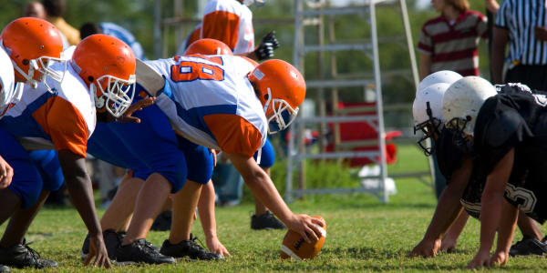 Youth playing football