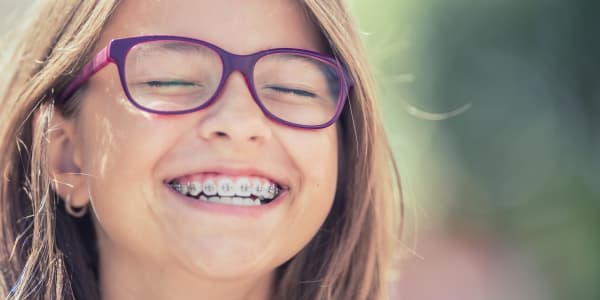 Smiling little girl with braces