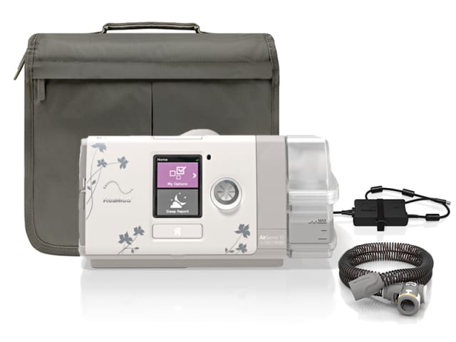 ResMed Autoset For Her Machine infront of Travel bag, Heated tube and power supply