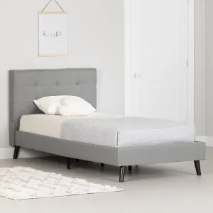 Cama tipo plataforma tapizada con cabecera