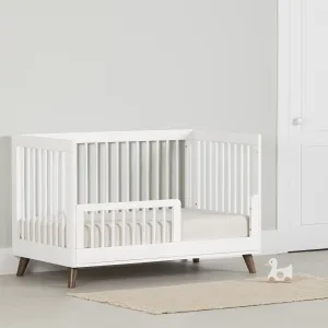 Ensemble lit de bébé et barrière de transition