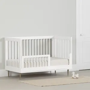 Ensemble lit de bébé et barrière de transition